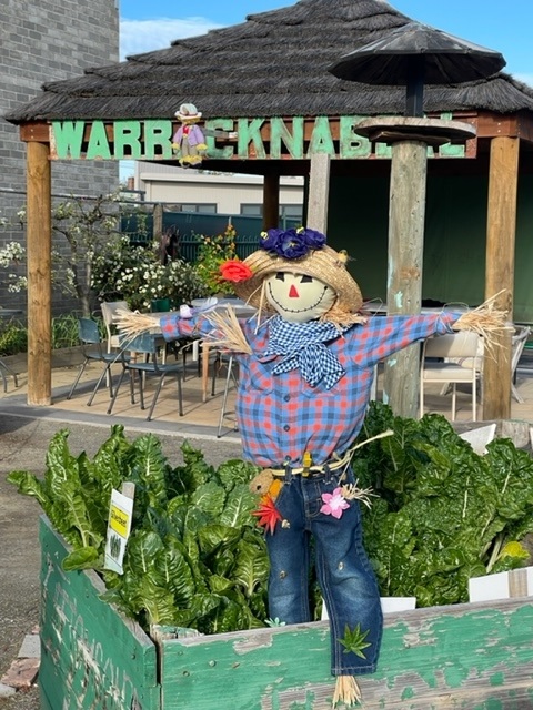 scarecrow-in-front-of-hut.jpg